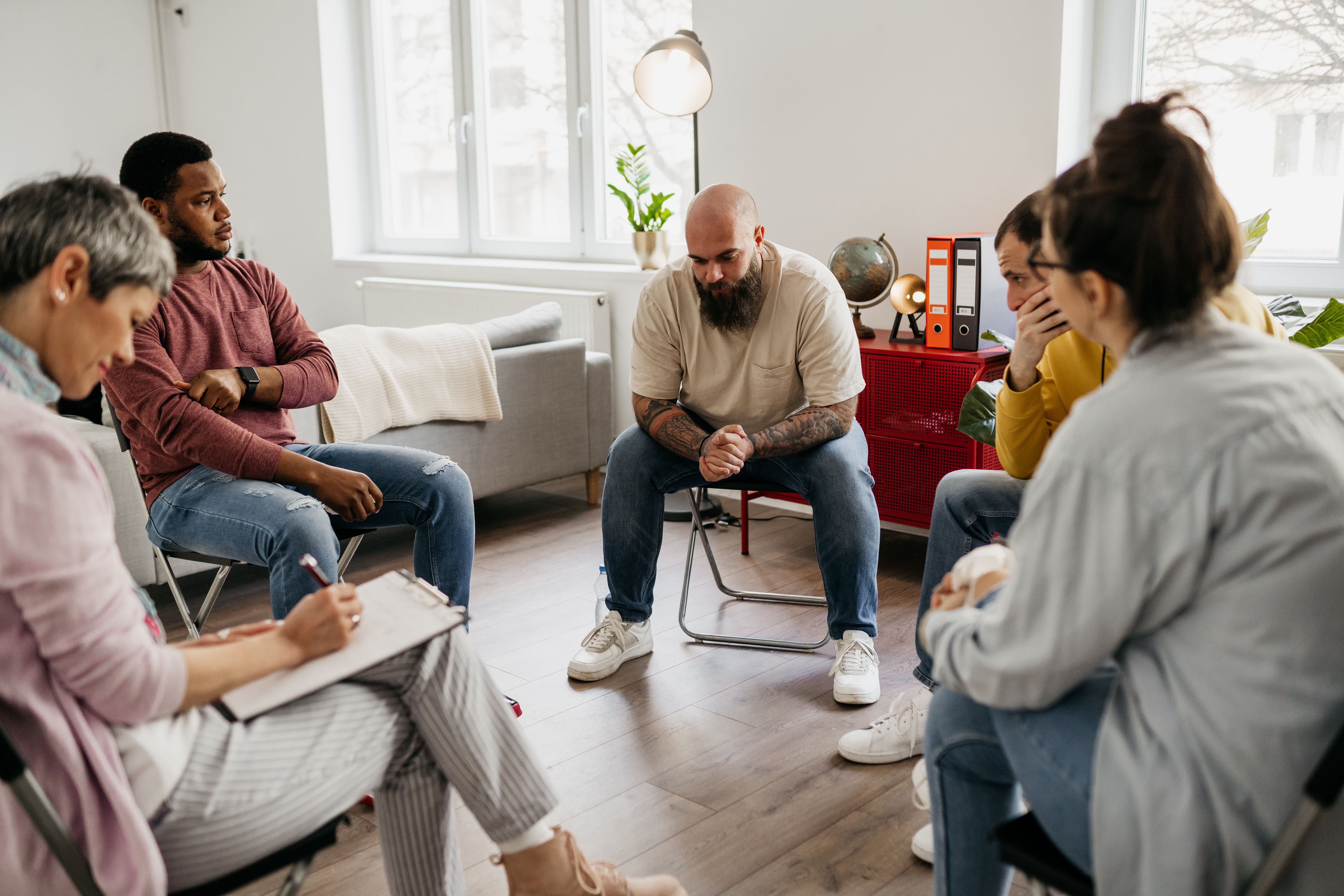 Multiracial group of people having a psychotherapy