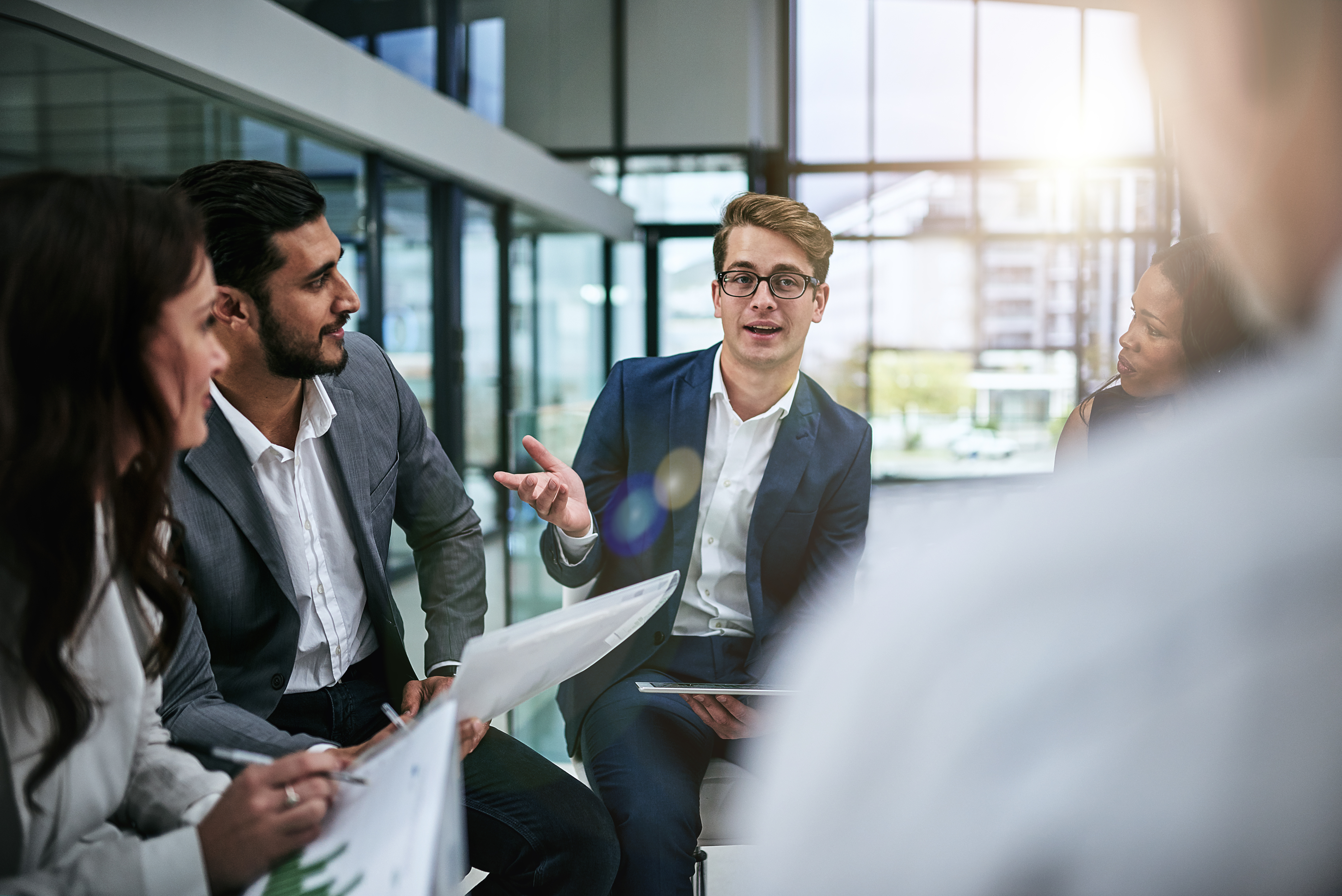 Shot of a group of colleagues having a meeting in a modern office